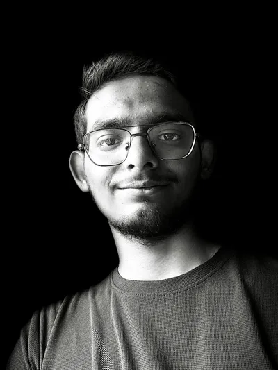 Image of the author smiling and eating desserts